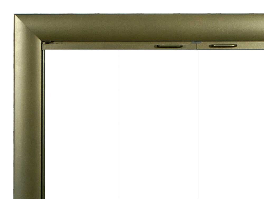 Close-up of a golden-framed display with a white interior. Hinges are visible along the top edge.