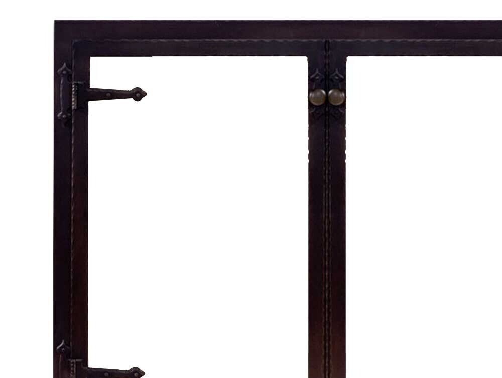 Black metal gate with decorative hardware.
