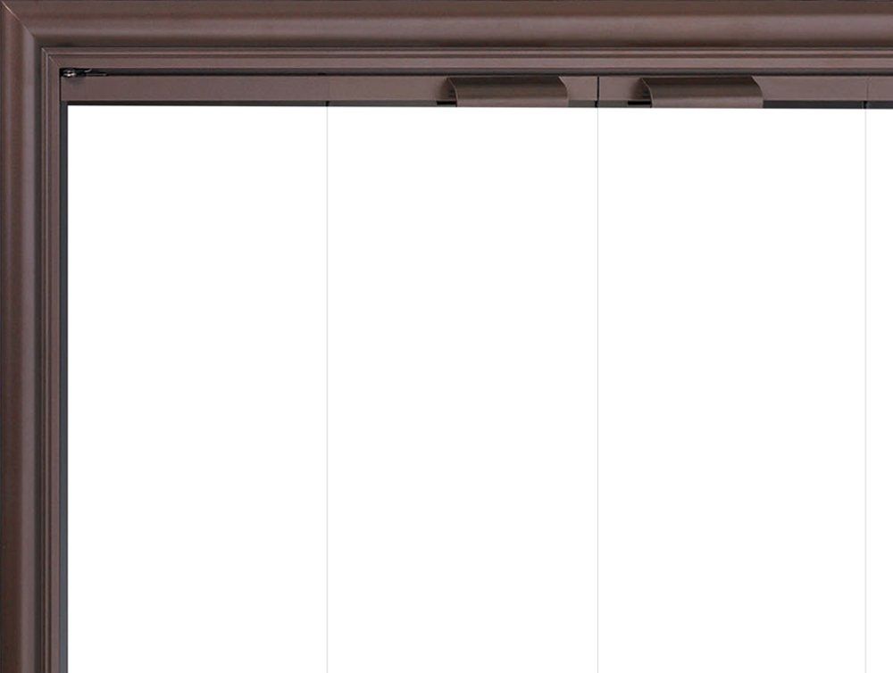 Bronze-framed window with three transparent panels and an upper track.