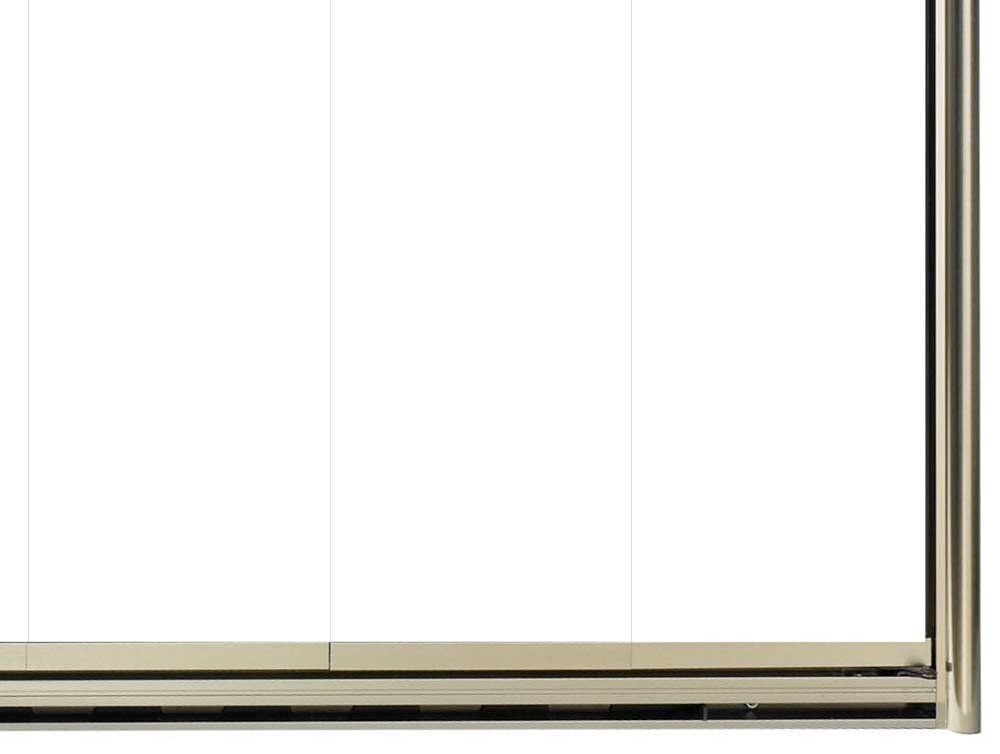A tan linear radiator against a white wall.