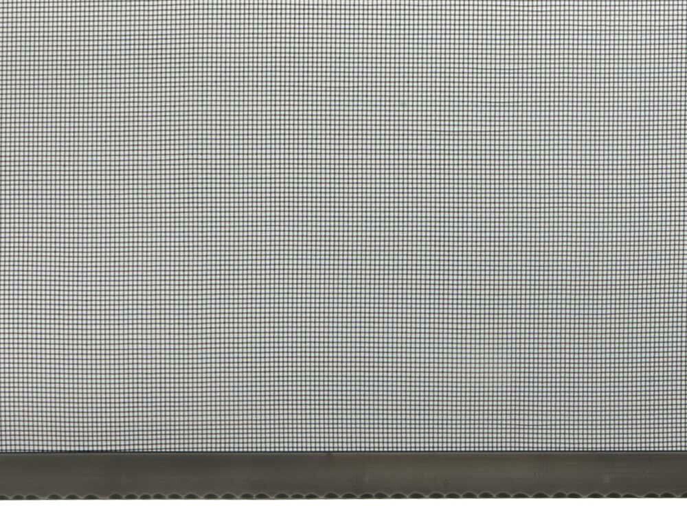 Close-up of a gray window screen with a dark gray border at the bottom.