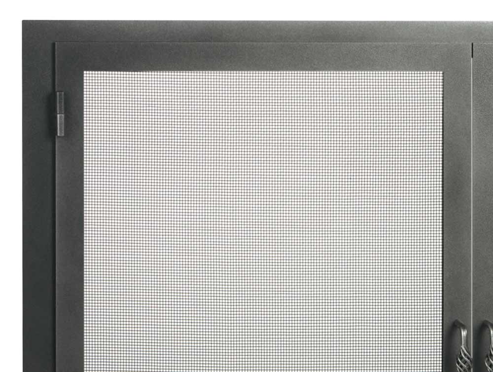 Close-up of a dark metal fireplace screen with a mesh center panel and hinges.
