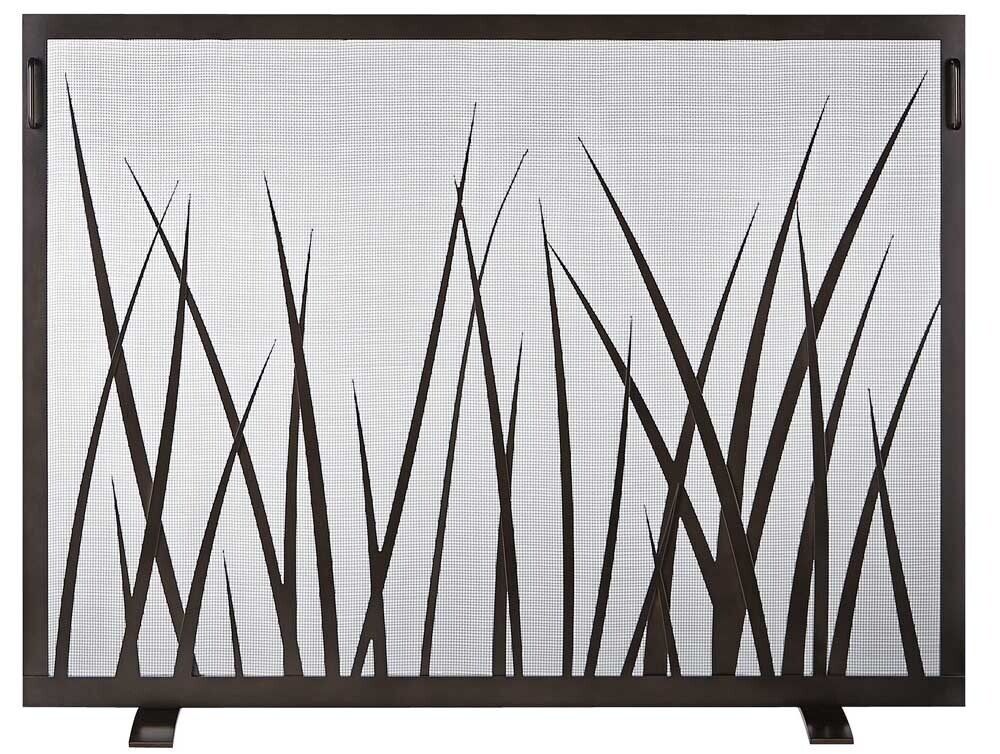 Fireplace screen with dark metal frame and grass-like cutout design.