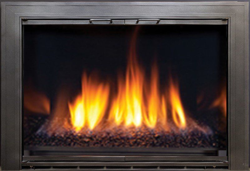 Gas fireplace with orange flames and dark interior, framed by a metal border.