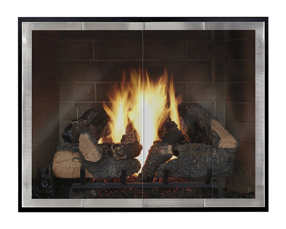 Fireplace with burning logs behind a glass screen in a dark, brick-lined setting.