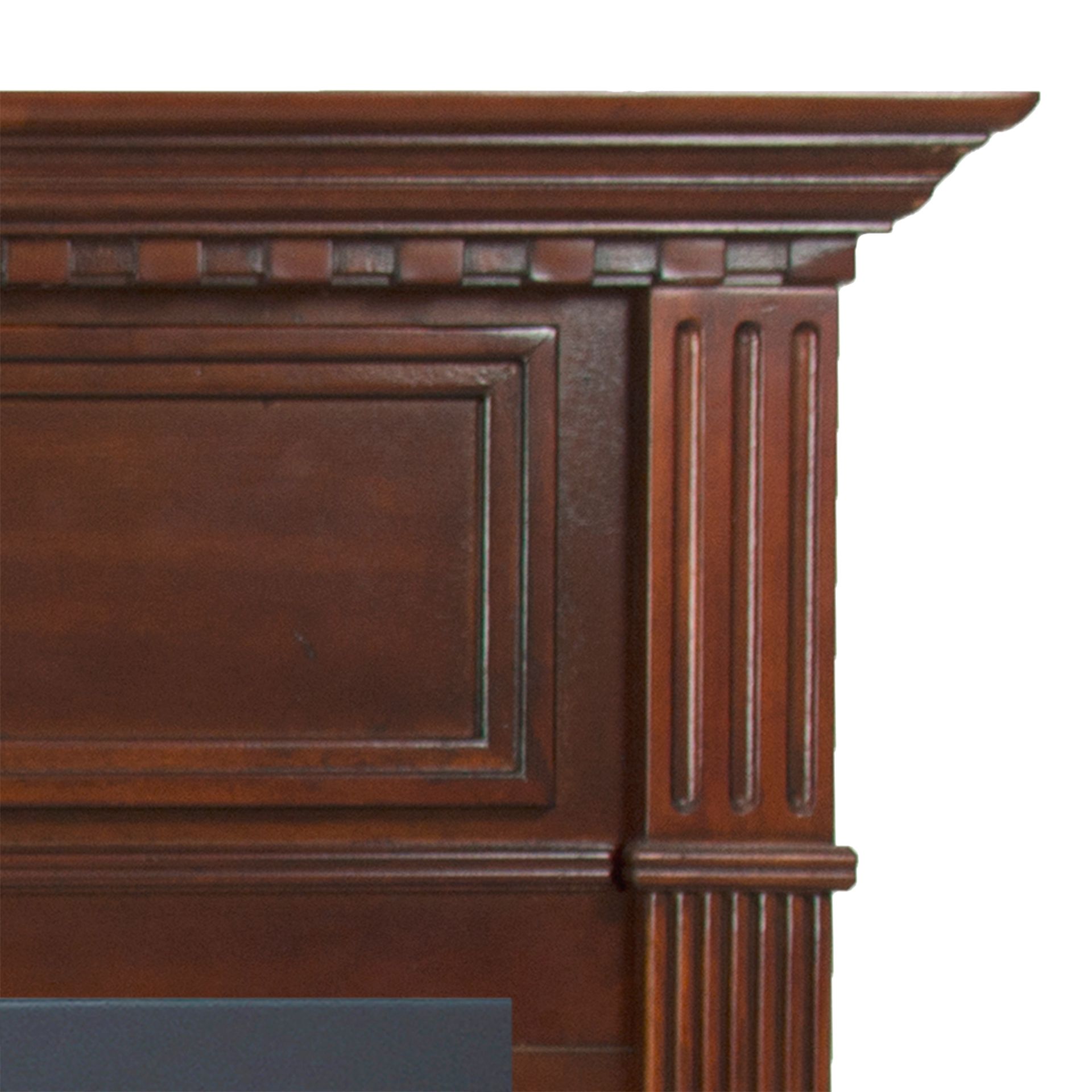 Close-up of a dark brown wooden fireplace mantel with rectangular panels and fluted column detail.