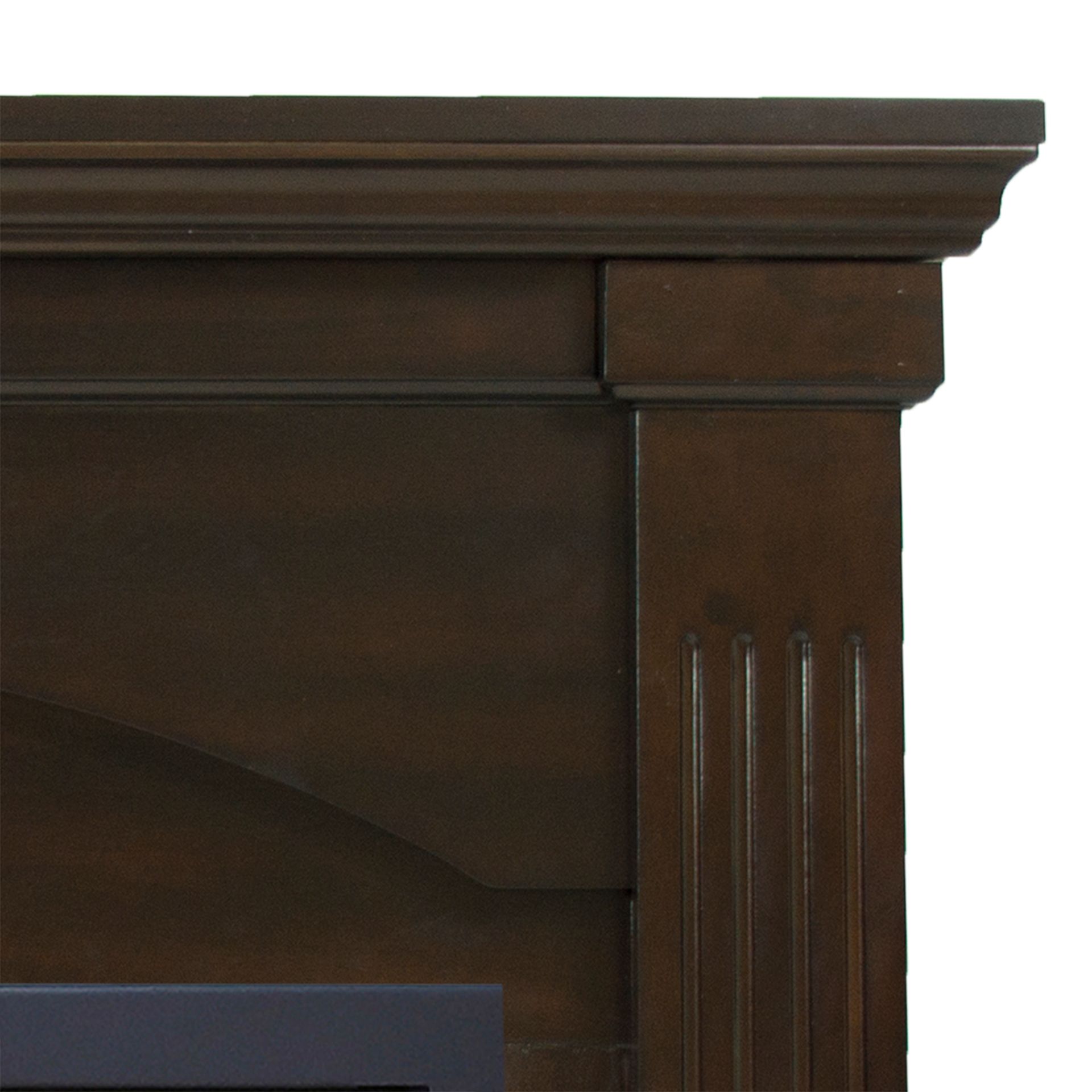 Brown wooden fireplace mantel with decorative molding.