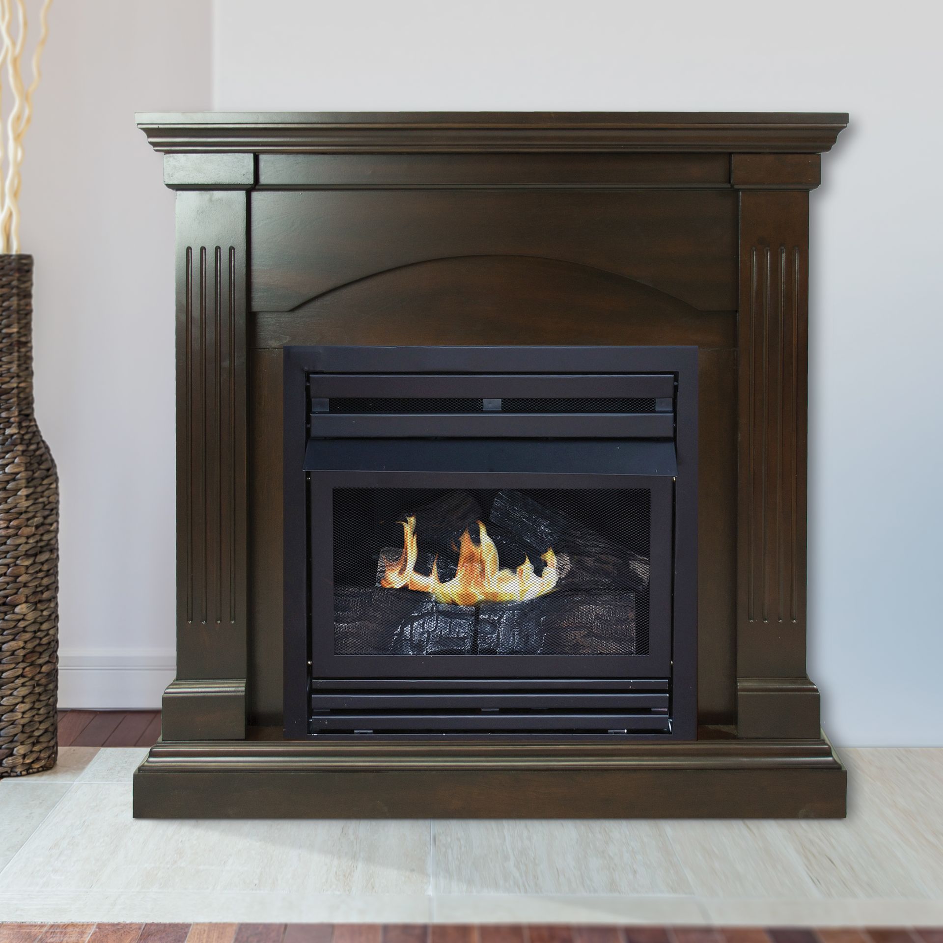Dark wooden fireplace with a black firebox containing flames.