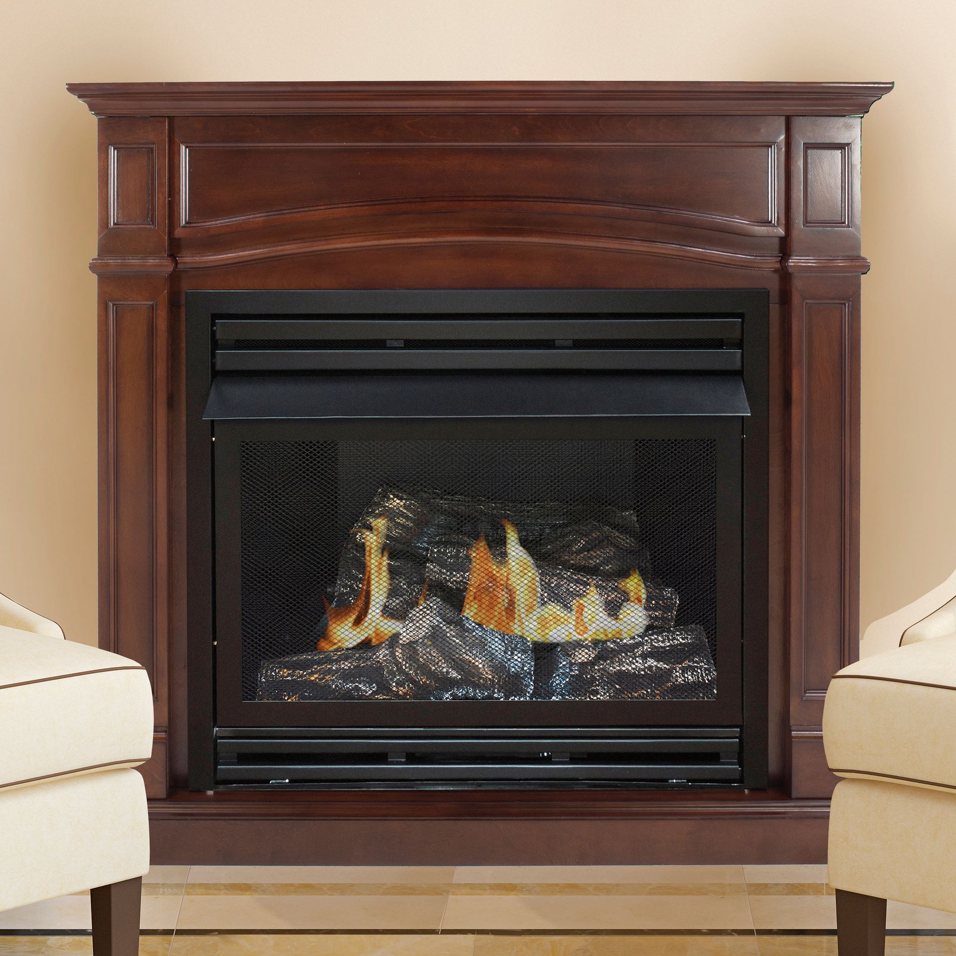 Fireplace with dark wooden mantel, flames behind a mesh screen. Two beige armchairs flank the fireplace.