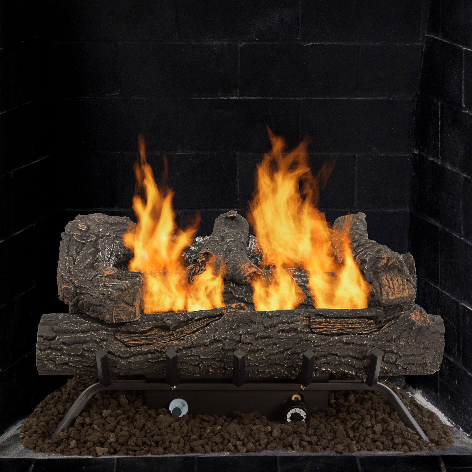 Fireplace with burning logs, dark brick background.