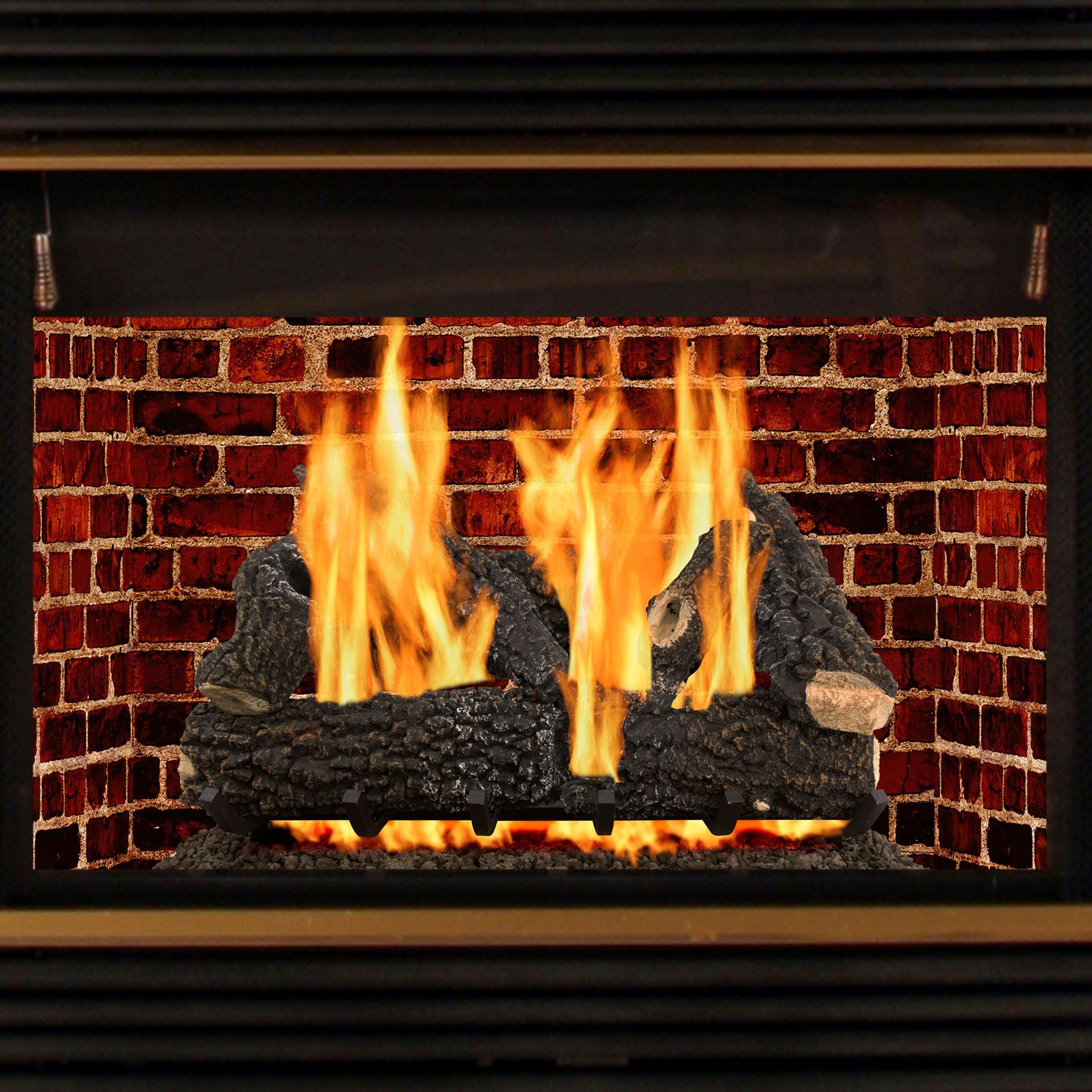 Fireplace with burning logs and orange flames against a brick background.