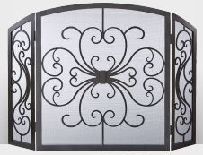 Black wrought iron fireplace screen with ornate scrollwork design.