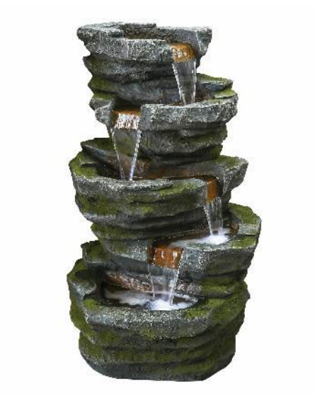 Stone tiered waterfall fountain, water cascading down levels.