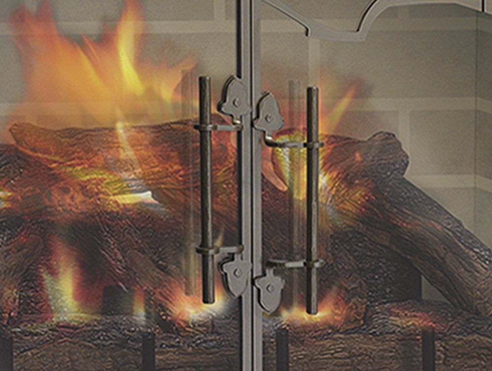 Fireplace with lit logs, glass doors, and decorative handles.