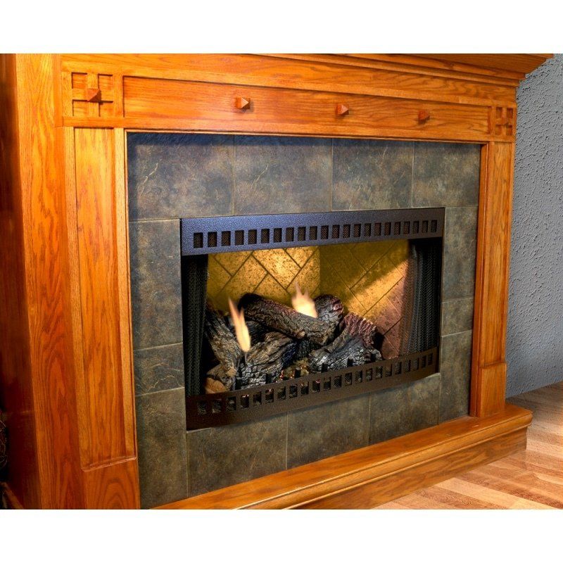 Fireplace with wooden mantel, tile surround, and lit gas logs.