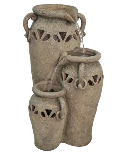 Tiered outdoor water fountain with three textured tan-colored urns, water flowing from the top urn to the lower ones.