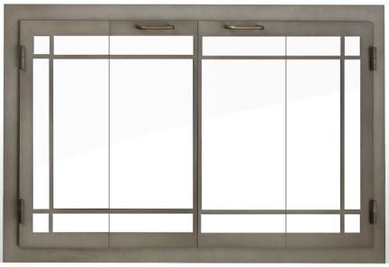 Metal fireplace door with glass panels and a grid design.