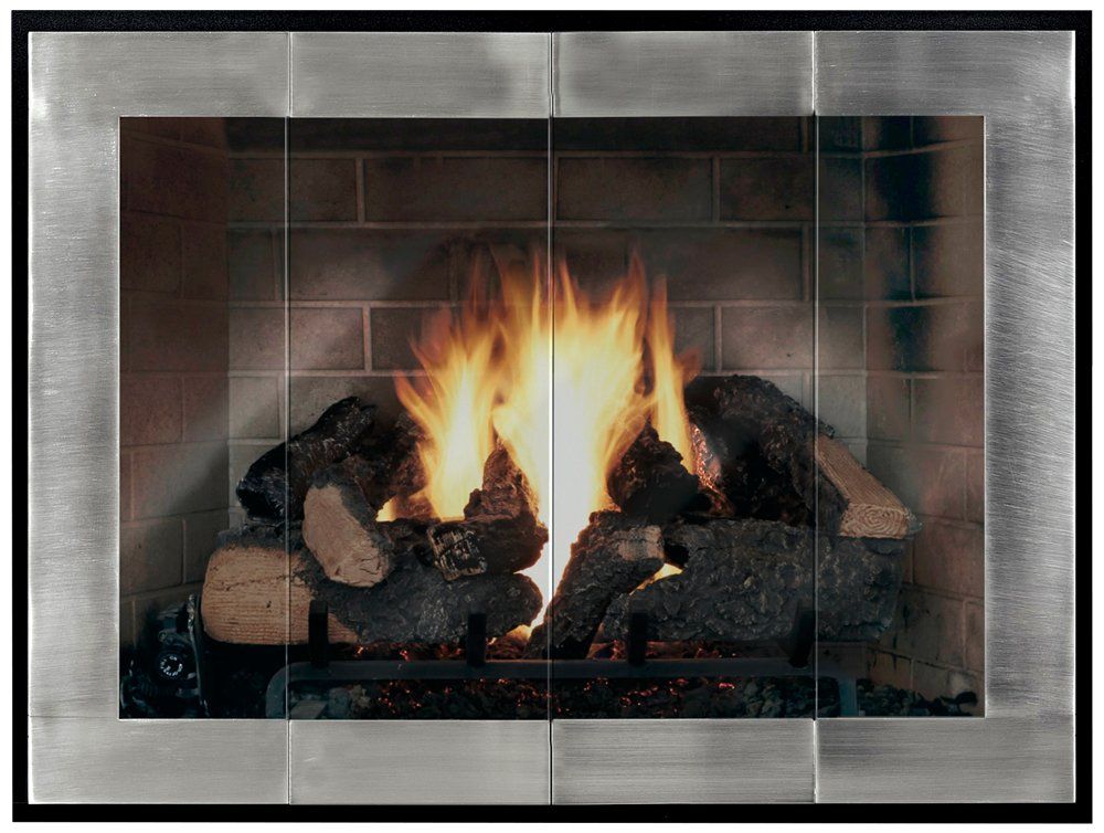 Fireplace with burning logs, behind glass doors within a metal frame.