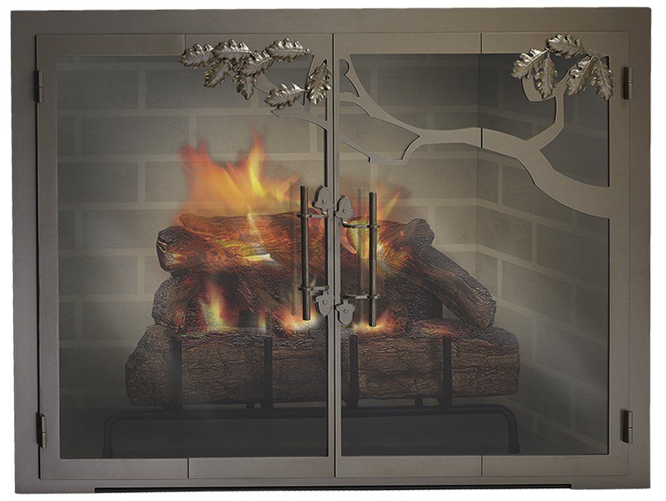 Fireplace with burning logs behind a decorative metal screen with floral accents.