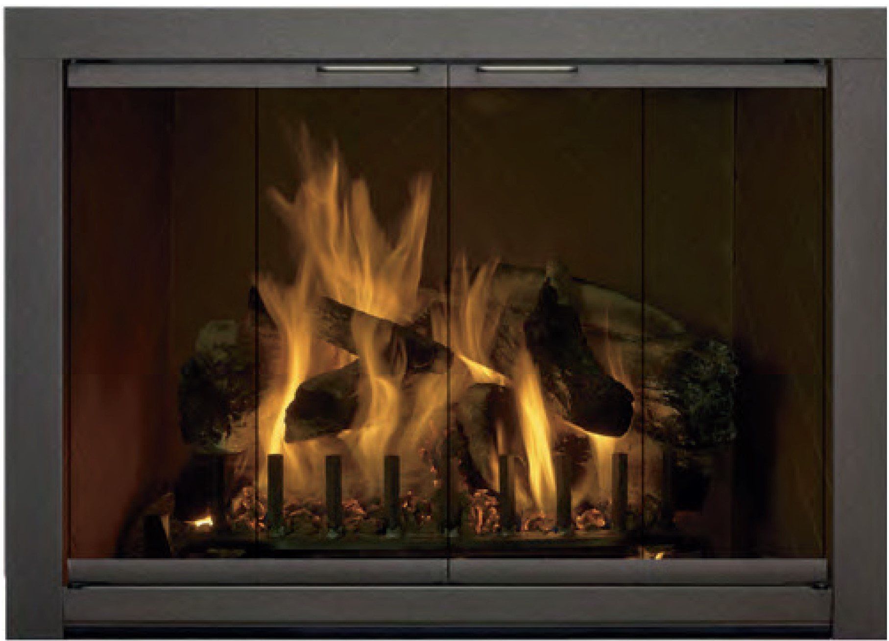 Fireplace with glass doors and burning logs, flames in shades of yellow and orange.