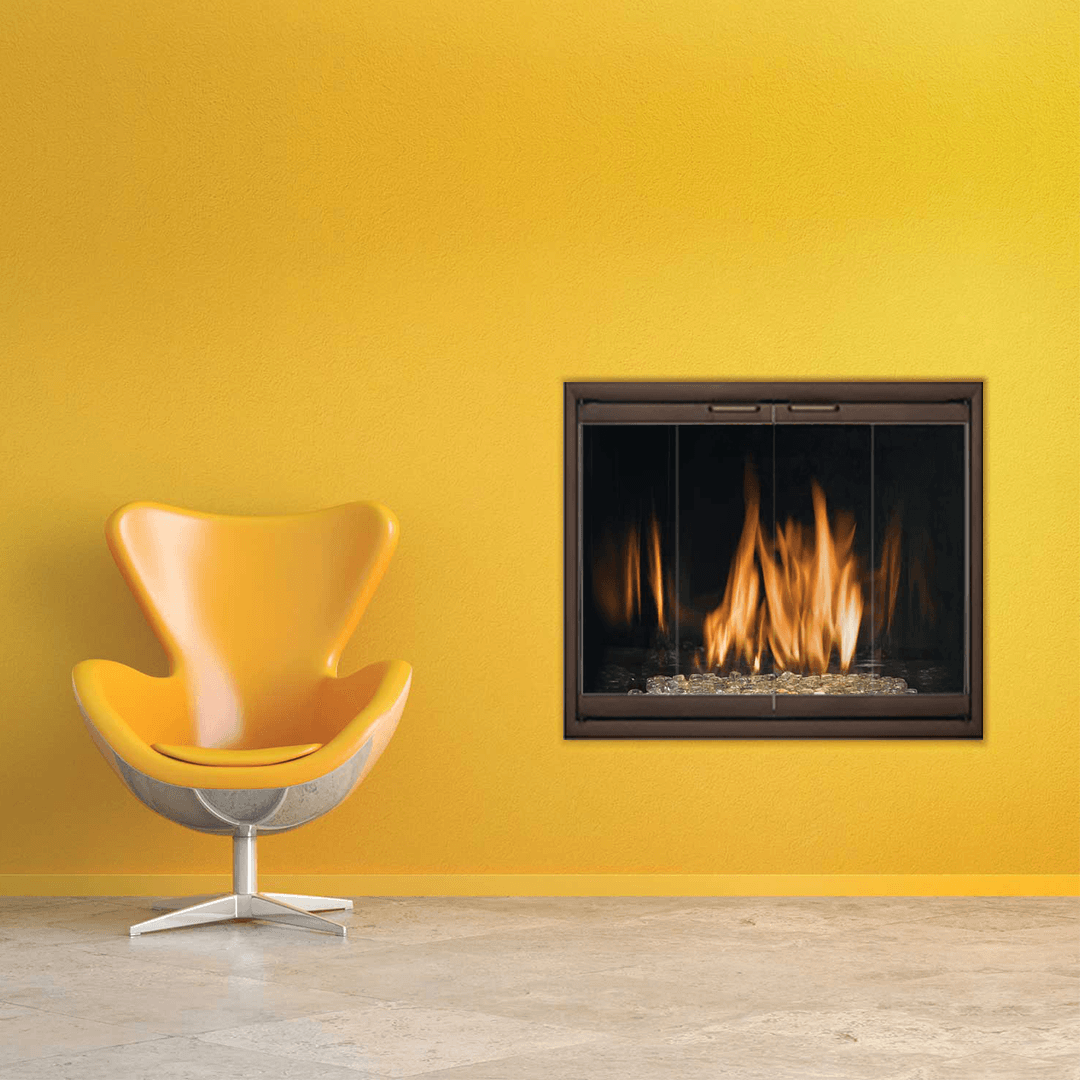 Yellow wall with fireplace and modern orange chair.
