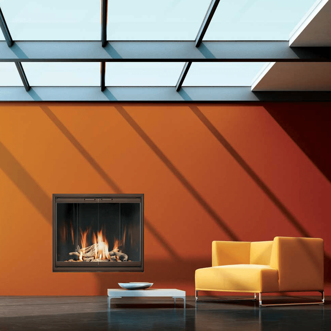 Modern living room with fireplace, orange wall, yellow chair, and skylight.