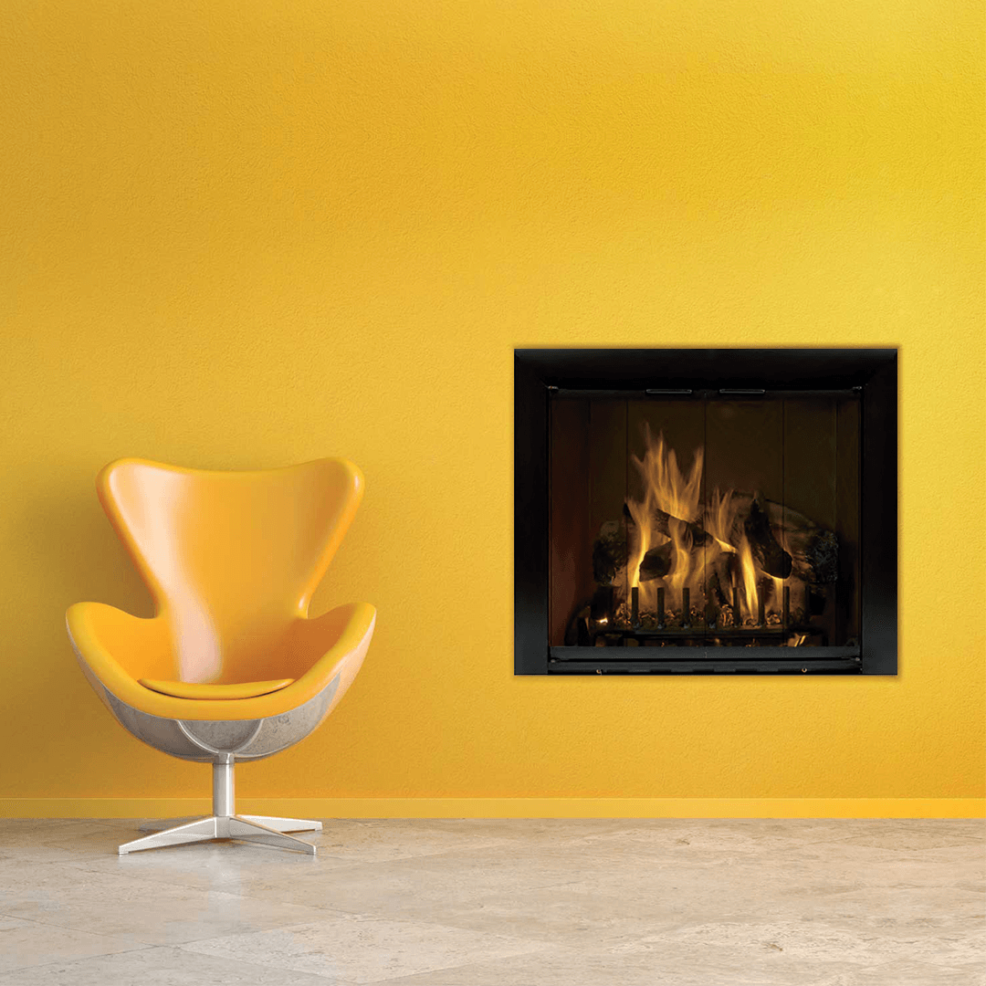 Yellow chair next to a fireplace in a yellow-walled room, flames visible.