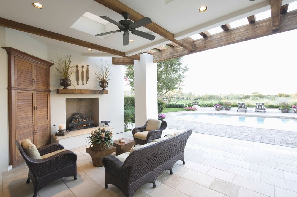 A Patio With a Fireplace and a Ceiling Fan — Mick Sawtell Electrical Pty Ltd in South Lismore, NSW