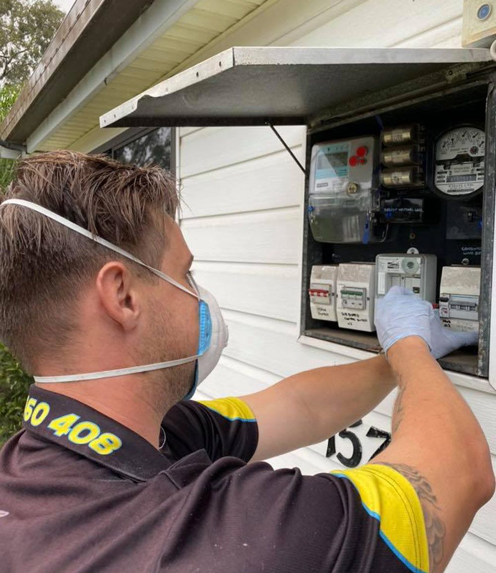 Electrician Inspecting Residential Electrical Meter