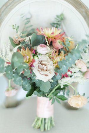 Pastel bouquet with pink, white, and green flowers in a hand-tied arrangement