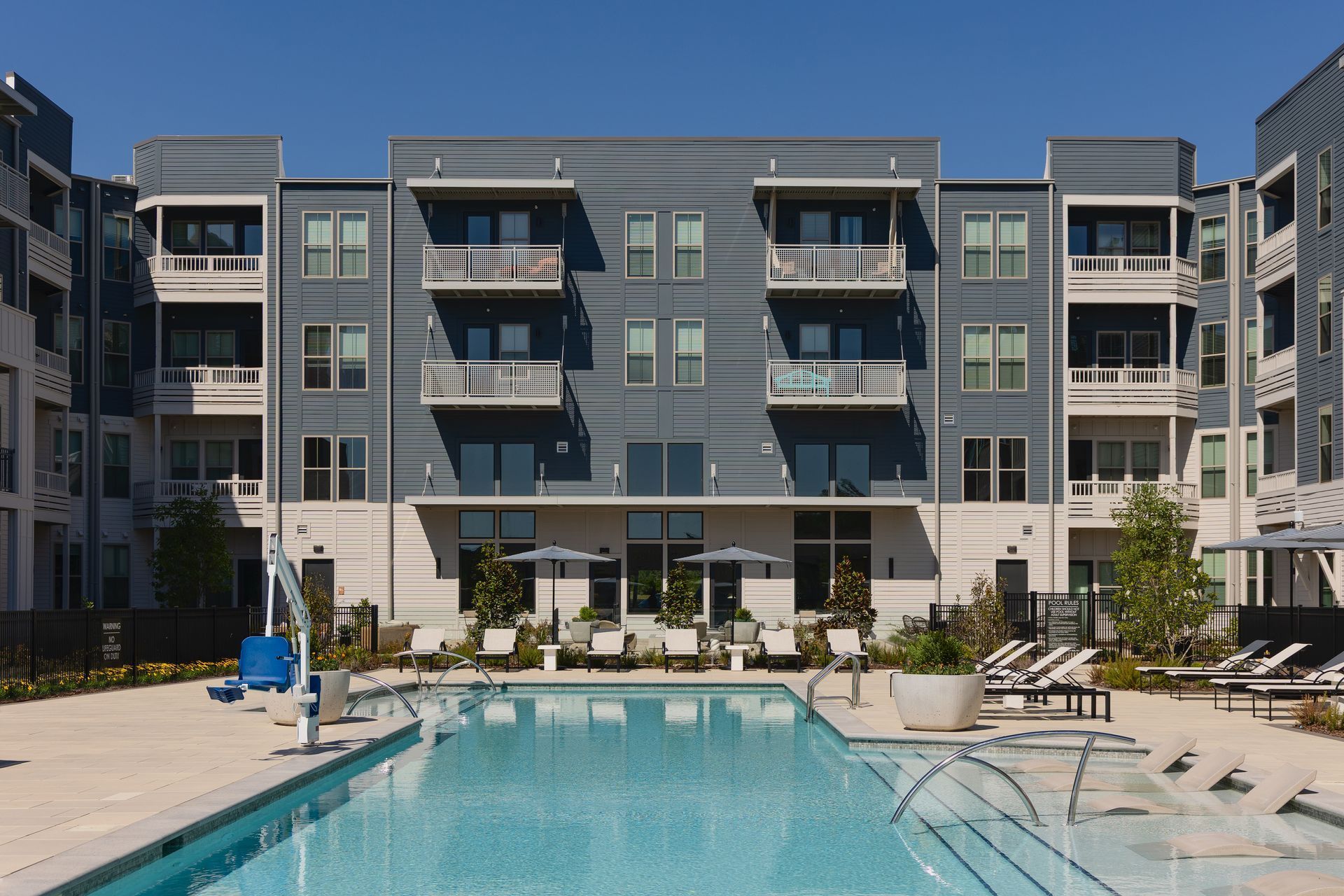Inviting swimming pool on a beautiful day at Livano Liberty Park.