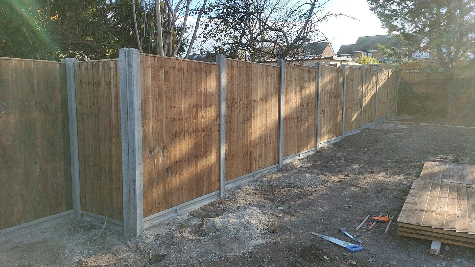 Panel fence in concrete posts and gravel board