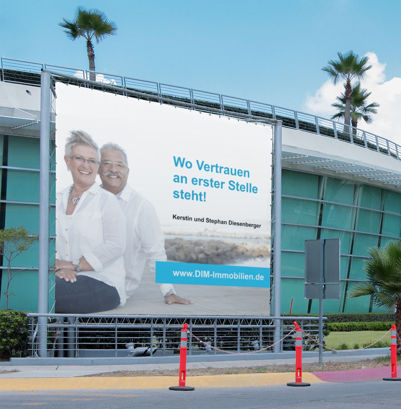 A large billboard on the side of a building says wo vertragen an erster stelle steht