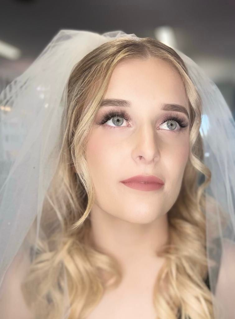 A Close Up of a Woman Wearing a Veil on Her Head — Xquisite Styles in Mount Warrigal, NSW