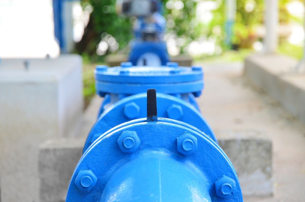 A Industrial Pipes with Bolted Flanges and A Handle — Professional Plumber in Toowoomba