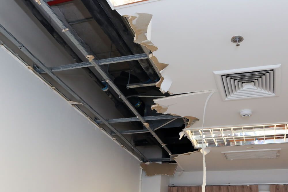 Room with A Big Hole in The Ceiling — Professional Plumber in Toowoomba