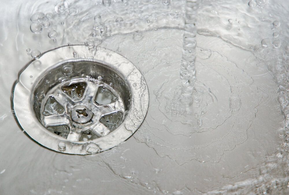 Water Is Running Down a Drain in A Sink — Professional Plumber in Toowoomba
