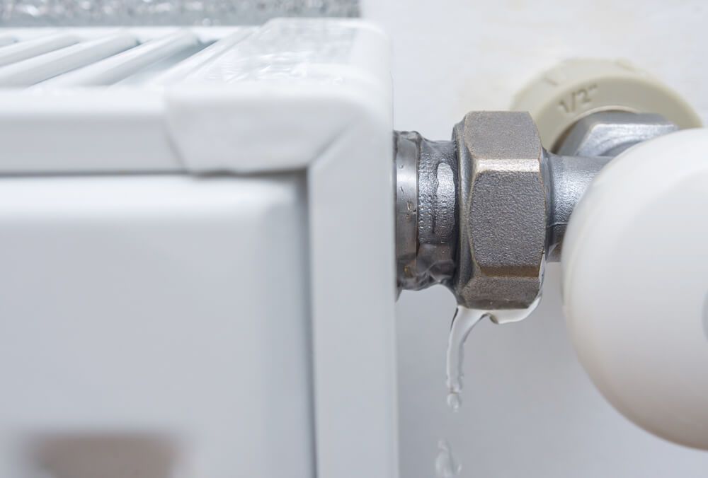 Close up Of a Radiator with Water Leaking out Of It — Professional Plumber in Toowoomba