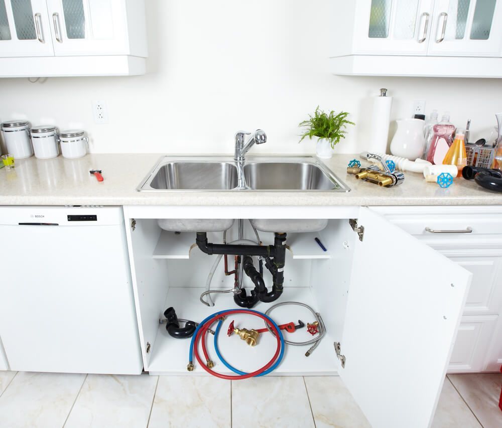 Kitchen Sink Being Repaired — Professional Plumber in Toowoomba