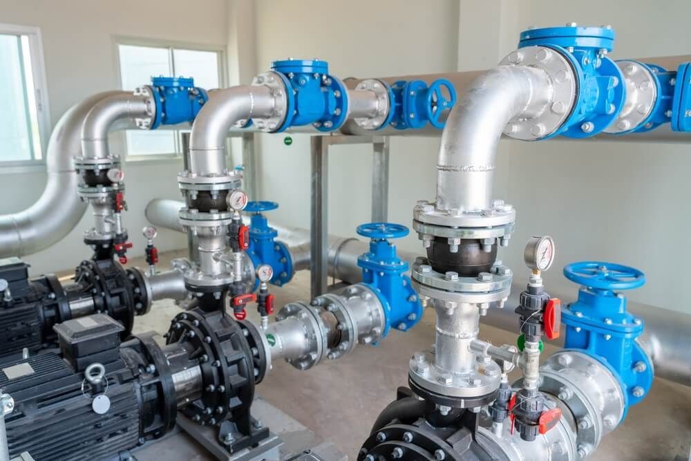 A Room Filled with Lots of Pipes and Pumps — Professional Plumber in Toowoomba 