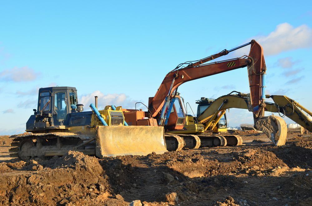 Diverse range of excavation machinery aligned in formation — Stan Davies Excavations in Maitland, NSW