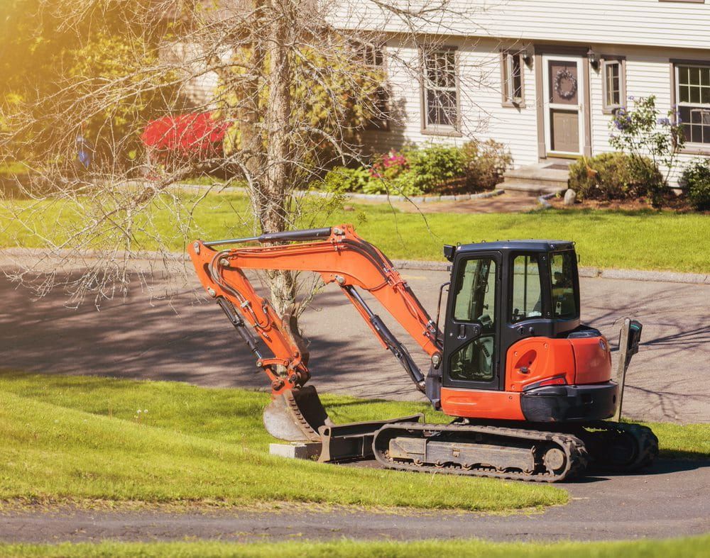 Compact orange excavator, ideal for residential, civil, landscaping excavation, and land clearing projects — Stan Davies Excavations in Lake Macquarie, NSW