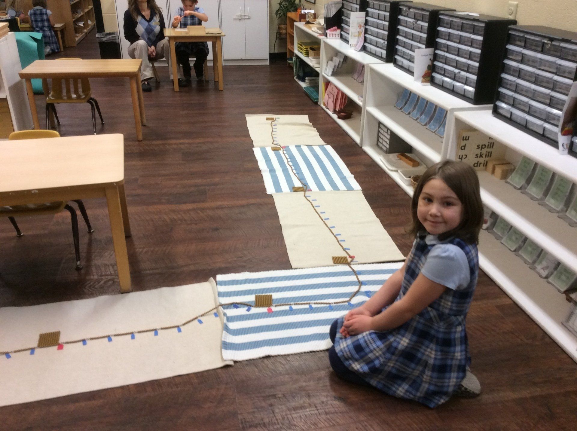 Children working with the pink tower