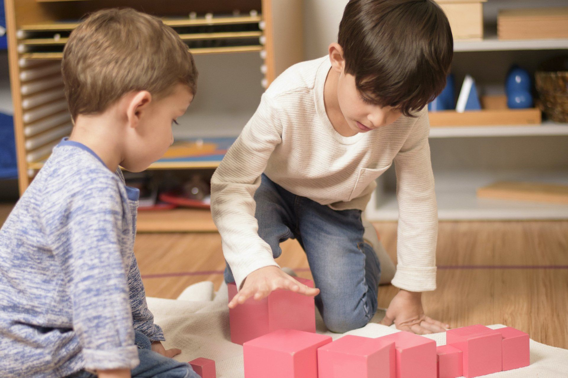 Children working with the pink tower