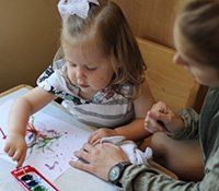 Guide and child in the classroom