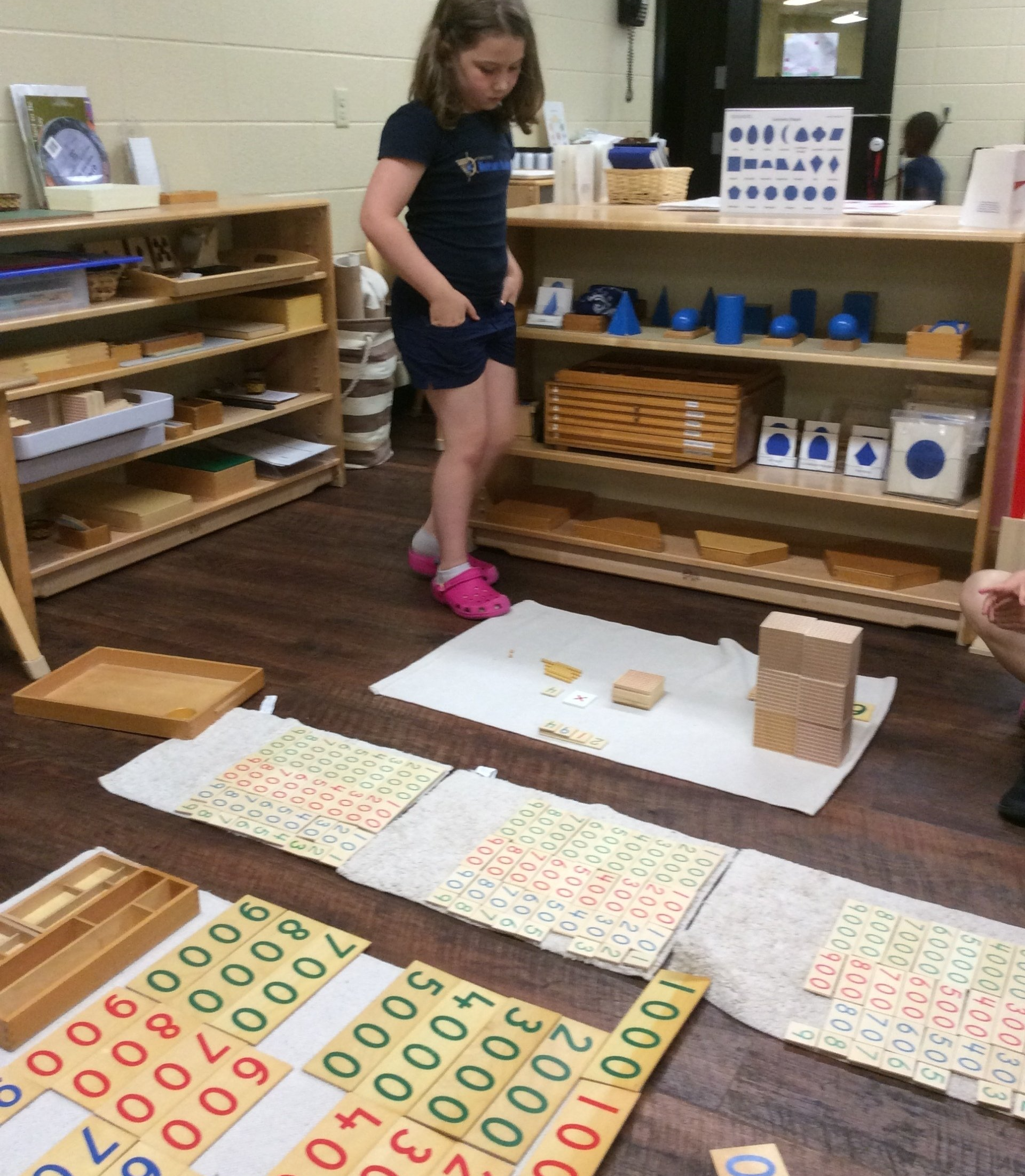 Children working with a world map puzzle