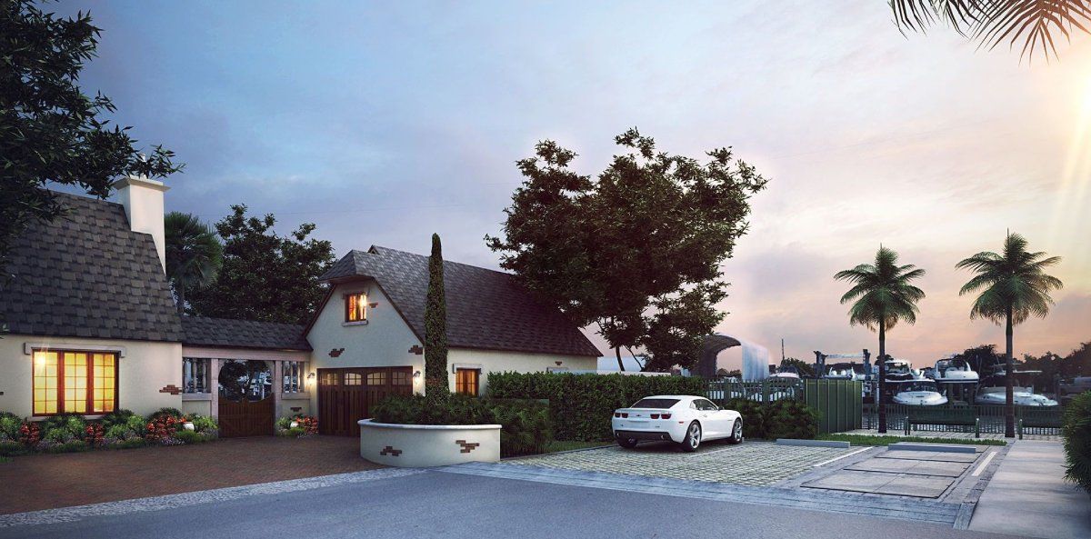 A white car is parked in front of a house