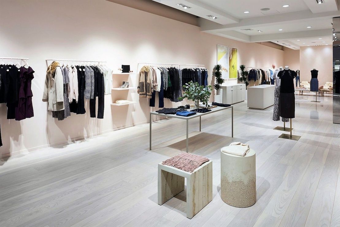 A clothes store with a lot of clothes on display