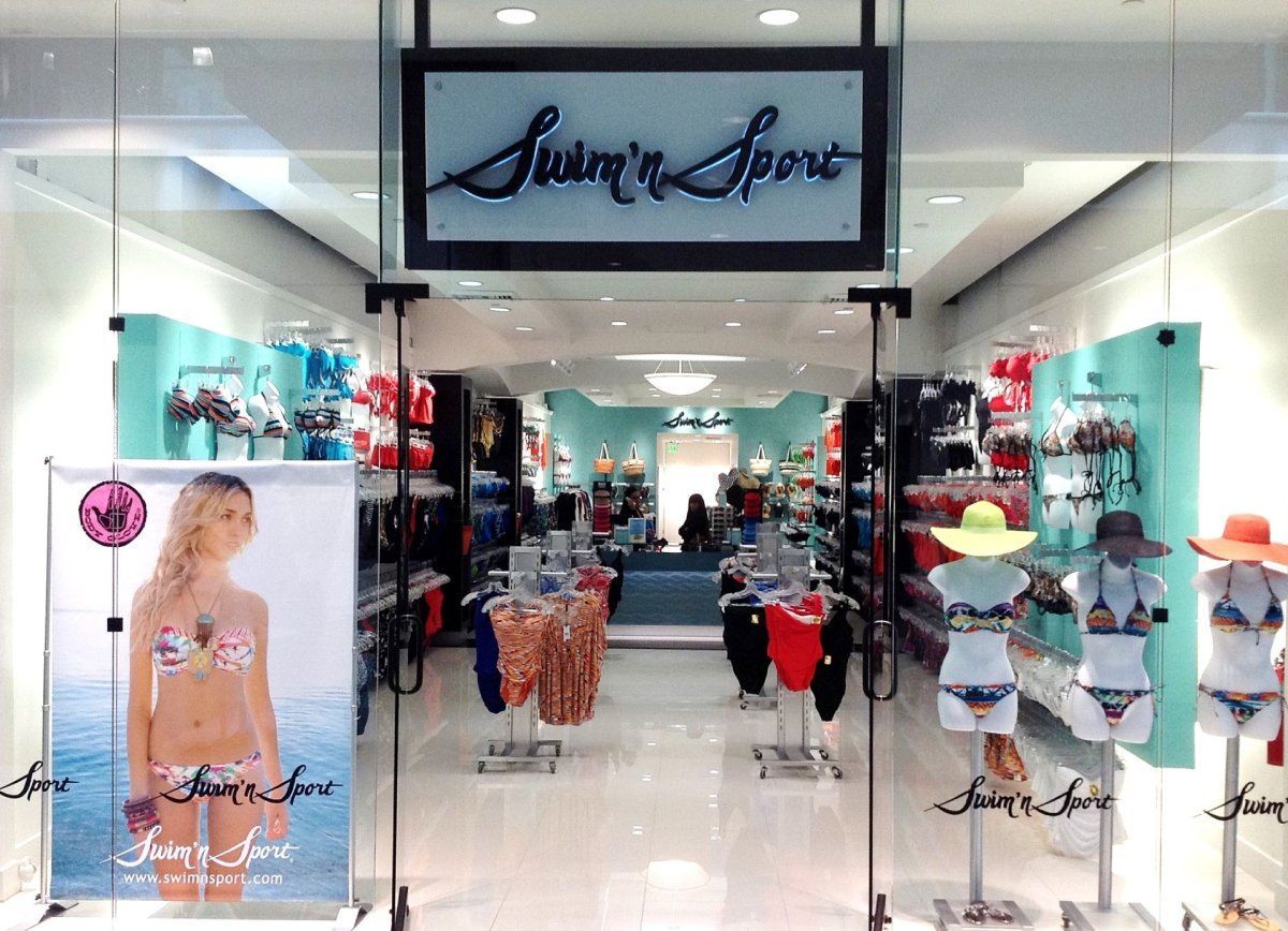 A store with a sign that says ' swimwear sport ' on it from ARCWERKS