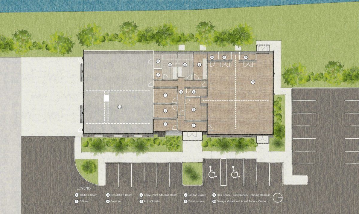 An aerial view of a building with a parking lot and a river in the background. from ARCWERKS